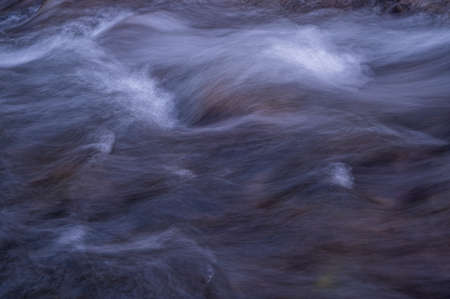 Water flowing over rocks. Long exposure. Abstract background. Beauty in nature.の写真素材
