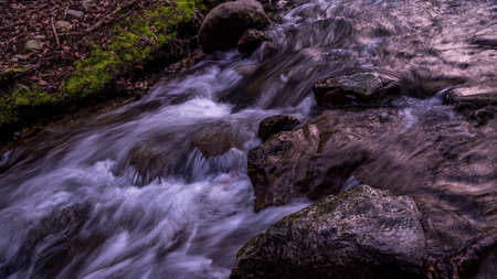 Water flowing over rocks. Beauty in nature. Long exposure. Lausanne, Switzerland. Tranquil scene.の写真素材