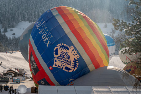 Chateau-d'Oex,Vaud, Switzerland - 23 January 2023: Hot Air Balloon. People working for the preparation of hot air ballooning before flight. International balloon festival.のeditorial素材
