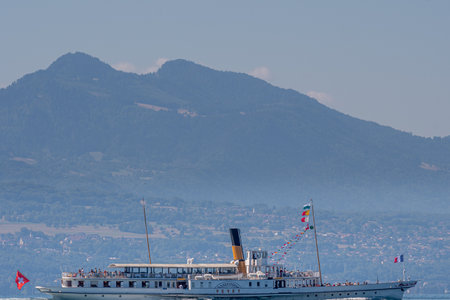 Boat on water. Swiss steamboat with passengers on Lake Geneva. CGN boat. Vevey, Vaud Canton, Switzerland.のeditorial素材