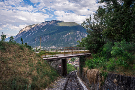 Landscape of Swiss Alps. Mountain, Sierre city, bridge and funicular trail in Switzerland. Crans Montana, Valais Canton, Switzerland.の写真素材