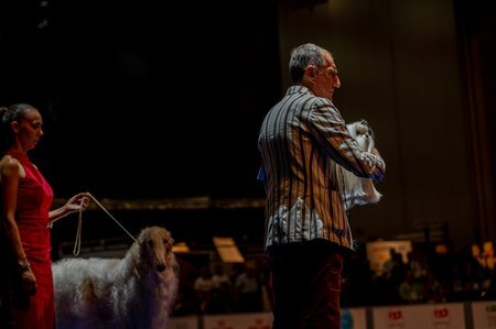 Geneva, Geneva Canton, Switzerland - 27 August, 2023: Handler presenting dog during World dog show.のeditorial素材