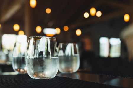 Glasses of Cold Water on a Table with a Blurred Backgroundの写真素材
