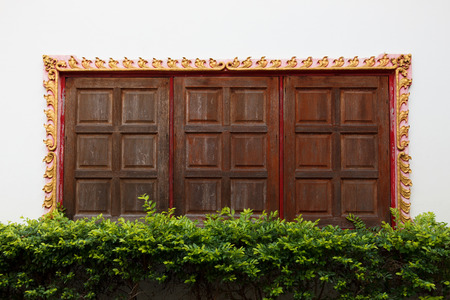 Thai style windows in temple.の写真素材
