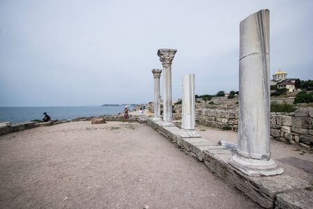 Ruins of the ancient Greek buildings on the Black Sea coast of Russia. Ancient Greek marble columns in Chersonesus Taurica. Sevastopol, Crimea.の写真素材