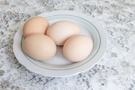 Raspberry curd pie recipe step by step. Yellow chicken eggs on white plateの写真素材