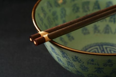 Chinese bowl isolated on a blackbackground. No trademark or logo shown.の写真素材