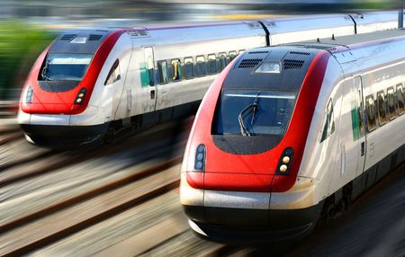 Train speeding along its tracks with motion blur.