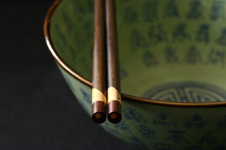 Chinese bowl isolated on a blackbackground. No trademark or logo shown.の写真素材