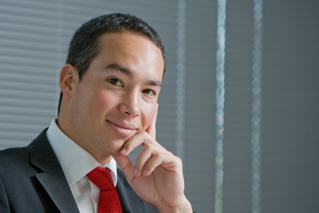 Business man holding a mobile or cell phone