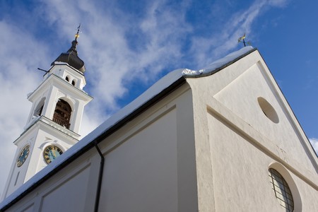 Holy church building with cross against blue skyの写真素材