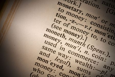 Closeup of the word money with a spot light on the textの写真素材