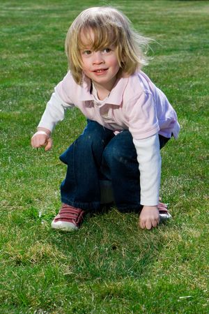 Cute young caucasian boy playing football or soccer outdoorsの写真素材
