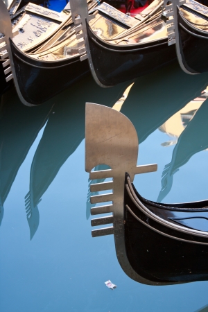 Closeup of a gondola park in a canal, in Venice Italyの写真素材