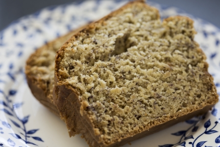 Two slices of freshly baked banana bread served on a plate