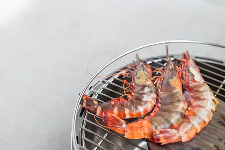 Tiger prawns being grilled with charring on the BBQの写真素材