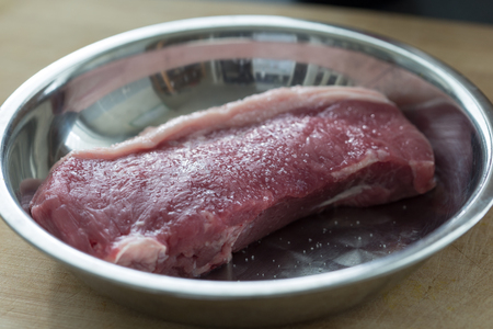 Close up of a piece of uncooked raw prime cut of beef steakの写真素材