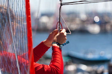 Kiel, Germany- June, 17th 2017: Sailor preparing for the sailing regattaのeditorial素材
