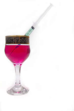 Full syringe with deadly poison in a glassの写真素材