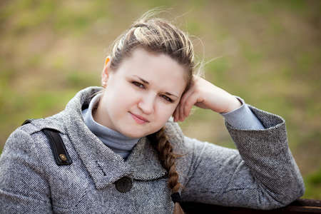 The girl longs on the nature