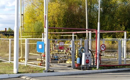 Gas equipment   rig into metal grid fenceの写真素材