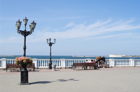 SEVASTOPOL, RUSSIA - SEPTEMBER 18, 2014: Primorsky boulevard on city embankment, people admire Black sea.のeditorial素材