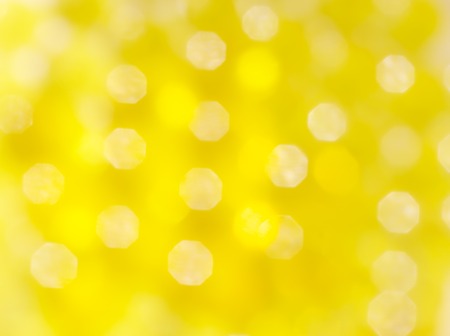 Abstract blur bright yellow golden bokeh backgroundの写真素材
