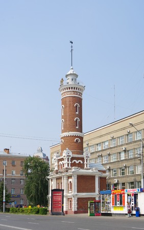 Omsk, Russia - August 07, 2010: historical monument, fire tower with figure of fireman on topのeditorial素材