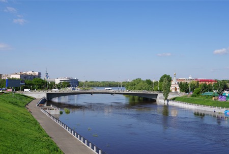Omsk, Russia - May 25, 2015: Summer views of river Om, Jubilee bridge and Seraphimo-Alekseevskaya chapelのeditorial素材
