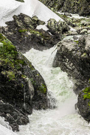 raging river in jotunheimen park in norwayの写真素材