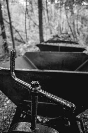 connection to a mine railway with wagons in the backgroundの写真素材