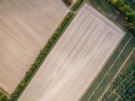some fields and a green reserve photographed from the airの写真素材