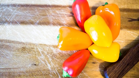 mixed paprika and knife on a cutting board