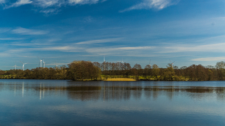 lake with wind millsの写真素材