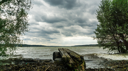 rain clouds and lakeの写真素材