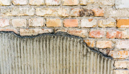 texture of an old brick wall with gray grout