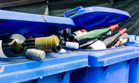 SCHWERIN, GERMANY - June 15, 2021 garbage bin filled with lots of wine bottlesのeditorial素材