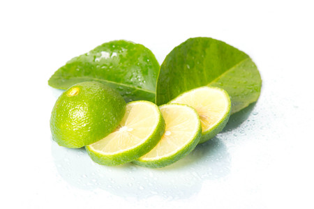 Sliced lime fruit isolated on white background with clipping pathの写真素材