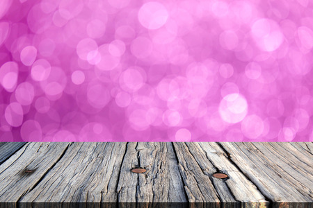 image of wooden table in front of bokeh backgroundの写真素材