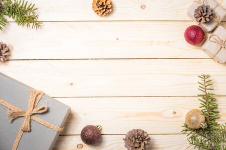 Christmas composition. Christmas gift. christmas ball. pine cones. fir branches on wooden white background.top view.の写真素材