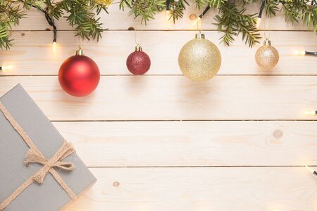 Christmas composition. Christmas gift. christmas ball. pine cones. fir branches on white wooden background.の写真素材