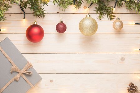 Christmas composition. Christmas gift. christmas ball. pine cones. fir branches on white wooden background.の写真素材