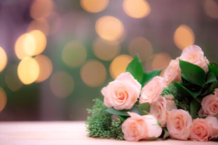 blur background rose flower on wooden table with gift box and copy spaceの写真素材