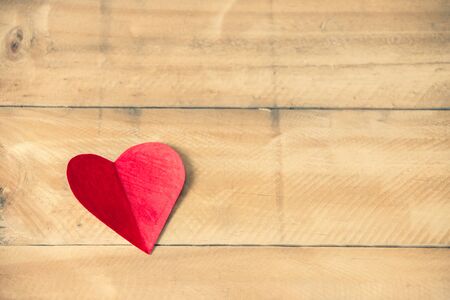 Red hearts paper on brown wooden table, Copy space to put messages on the Valentine's Dayの写真素材