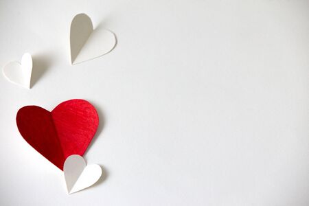 Red and white hearts paper on White paper, valentine's day beautiful backgroundの写真素材