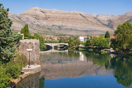 View of Trebisnjica river near Old Town of Trebinje city  on a sunny summer day. Bosnia and Herzegovinaの写真素材