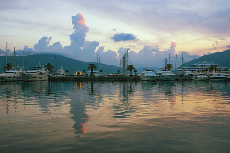 Beautiful evening landscape with yachts and its reflection in the water. Montenegro, Bay of Kotor (Adriatic Sea),Tivat, view of marina Porto Montenegroの写真素材