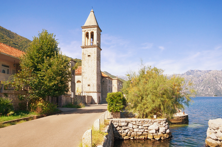 Sunny Mediterranean town. Montenegro, Adriatic Sea, Bay of Kotor. View of ancient town of Stoliv and Name of Mary Churchの写真素材