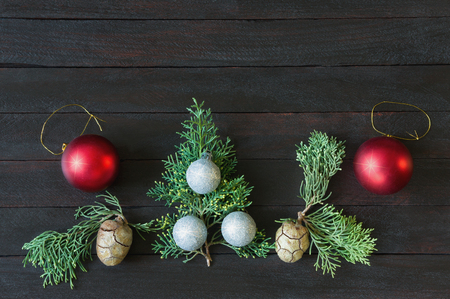 Christmas decorations on dark background. Flat lay, free space for textの写真素材