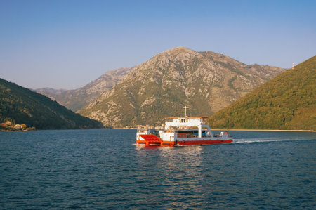 Ferry. Montenegro, Adriatic Sea, Bay of Kotor.  Ferryboat runs across narrowest part of the bay -  Verige Straitのeditorial素材